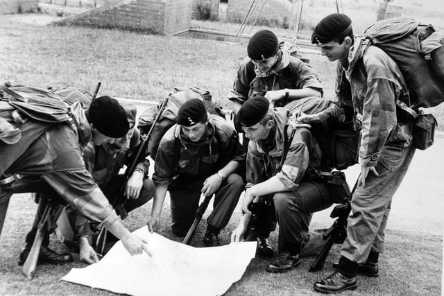 Harrogate. 8th August 1974
The four young soldiers from the Army Apprentices' College, Harrogate, who are to take part in Exercise Parashot with other units of the British Army, are instructed by Sgt.-Major John Hagard (left) and Sgt.-Major Bill Jamieson. From the left, they are: A./T. Malcom Whitehead, A./T. L./Cpl. Philip Legrove, A./T. L./Cpl. John McEwan and A./T. Sgt. John Hickman.