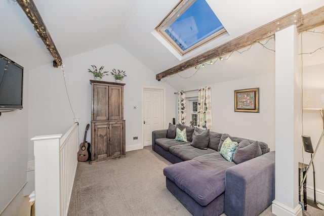 There is also a detached two-bedroom coachhouse with garage.
