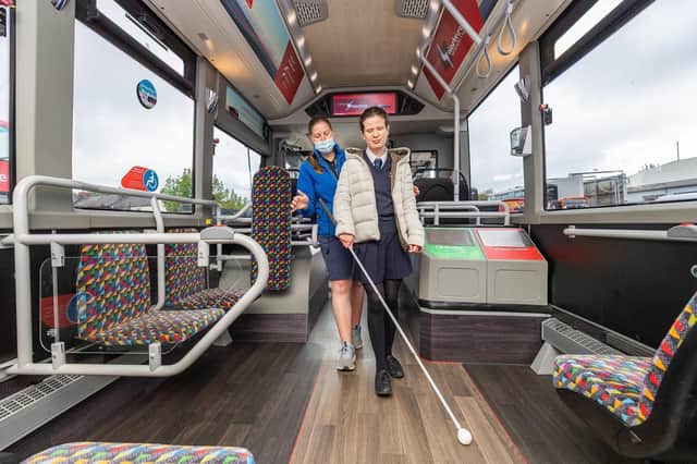 Amy, 16, makes her way to her seat on a Harrogate Electrics bus provided by The Harrogate Bus Company, supported by trainer Jessica Fawkes from the Guide Dogs charity.
