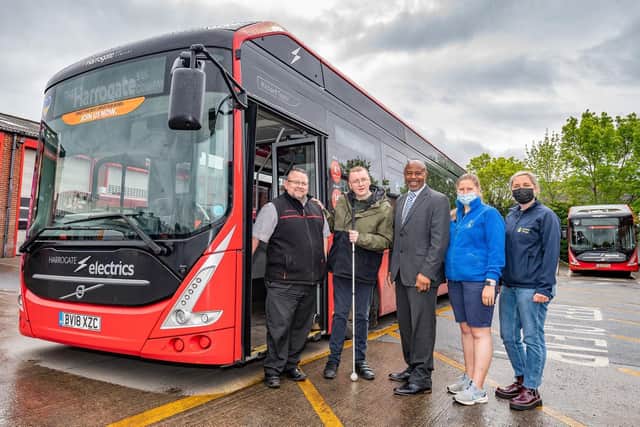 Visually impaired bus user Sam, 26, with (from left); Duty Manager Mark Smith and General Manager Steve Ottley from The Harrogate Bus Company, and Jessica Fawkes and Victoria Appleby-Smith from Guide Dogs.