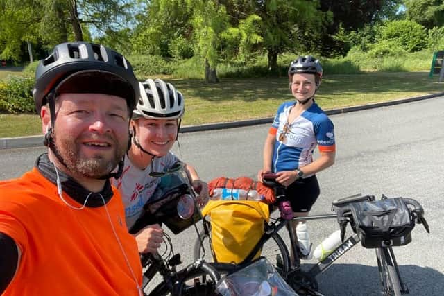 Harrogate's Andy Dennis and his partner Tracey Hill bump into a cyclist in France this week during the first week of their epic Ride the Rock charity ride.
