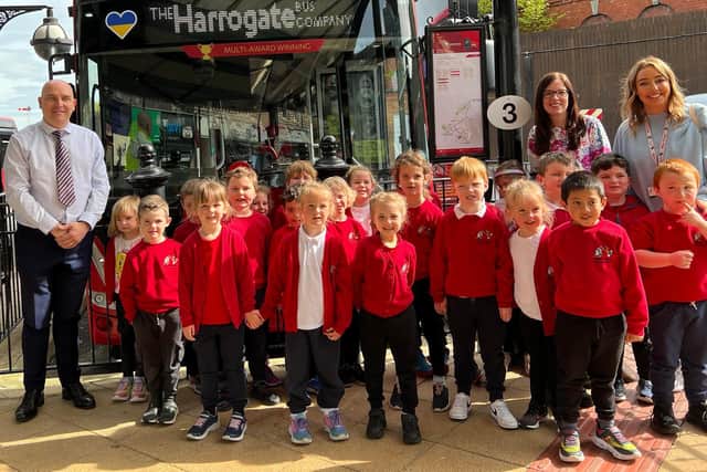 Pupils from Bilton Grange Primary School with The Harrogate Bus Company’s Service Delivery Manager Jason Asquith (left) and Teaching Assistant Vicky Sawyer (far right)
