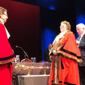 The handing over of the mayoral chains from outgoing mayor councillor Trevor Chapman to new mayor councillor Victoria Oldham. Photo: Harrogate Borough Council.