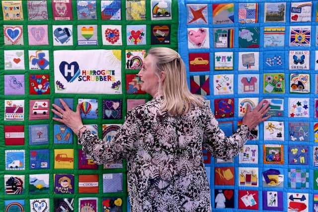 Pam Mullins with the Harrogate Scrubbers quilts. (Picture Gerard Binks)