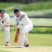 Pateley Bridge CC’s Chris Langley plays a forward defensive with Darley wicket-keeper Rob Hainsworth looking on. Pictures: Gerard Binks