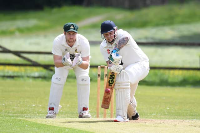 Pateley Bridge CC’s Chris Langley plays a forward defensive with Darley wicket-keeper Rob Hainsworth looking on. Pictures: Gerard Binks