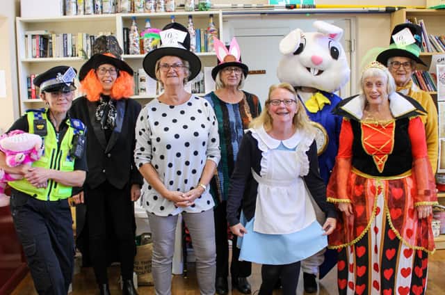 WiSE volunteers at a recenty Mad Hatter's Tea Party for the elderly.