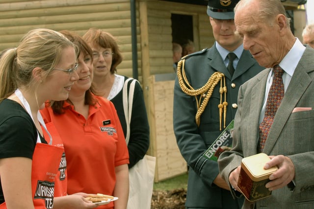 The Duke of Edinburgh receives some Prince Philip Special Box Yorkshire Tea  from Liz Earl  a Taylors of Harrogate employee at the  150th Great Yorkshire Show in Harrogate.