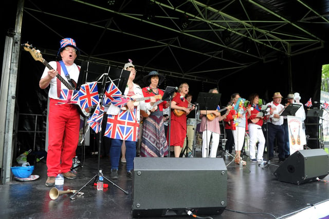 Local ukulele band, Harrogate Spa Ukes, performing on stage at the Jubilee Square.