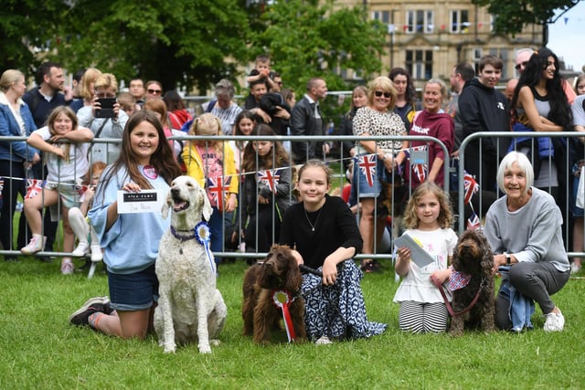 Winners in the 'waggiest tail' category with their pets at the Jubilee Square Dog Show.