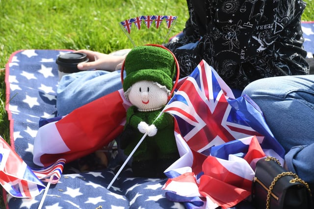 The Queen is spotted in amongst the picnics in the Jubilee Square.
