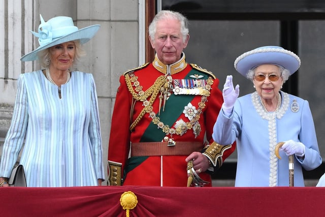Queen Elizabeth II stands with Camilla, Duchess of Cornwall Prince Charles, Prince of Wales, to watch a special flypast from Buckingham Palace balcony.