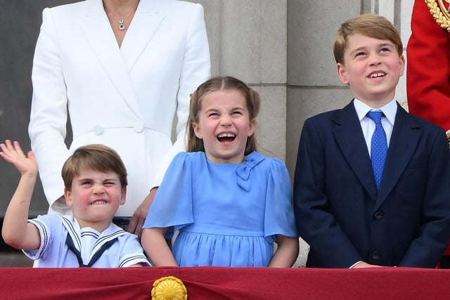 Prince Louis, Princess Charlotte and Prince George enjoy the special flypast from the Buckingham Palace balcony.