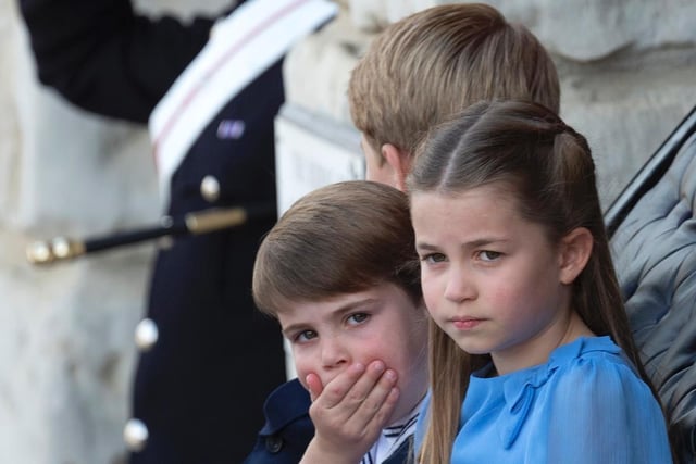 Princess Charlotte, Prince George and Prince Louis of Cambridge ride in a carriage during Trooping The Colour at Horseguards Parade.