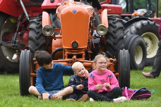 Sam Bailes (aged nine), Josh Sygrove (aged two) and Bella Sygrove (aged six) watching the tractors