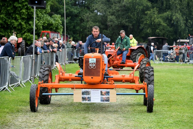 A tractor on parade in the main ring at the show