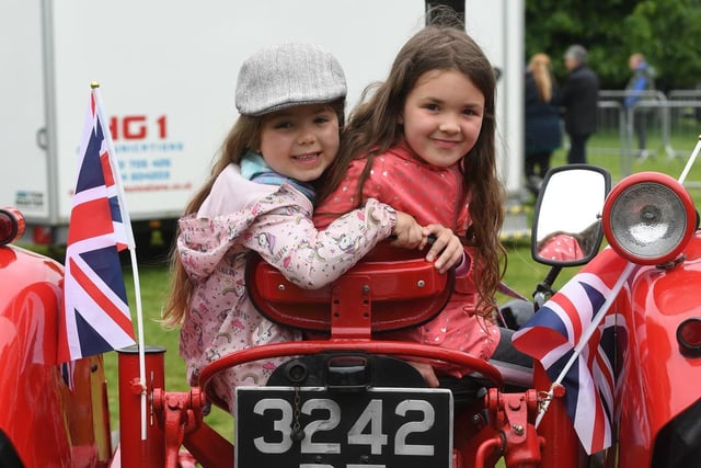 Gabrella Schofield (aged nine) and her sister Esme (aged five) pictured on the Jubilee tractor