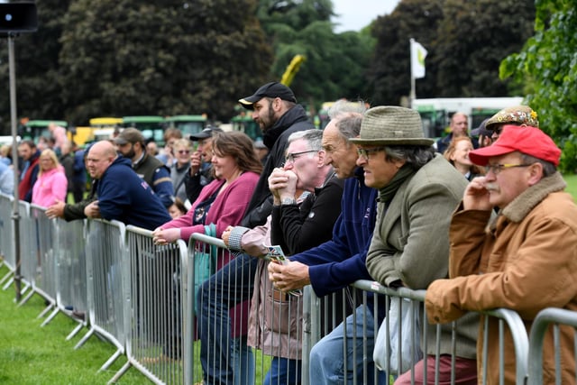 Crowds gather at the main ring at the show to see the tractors on display