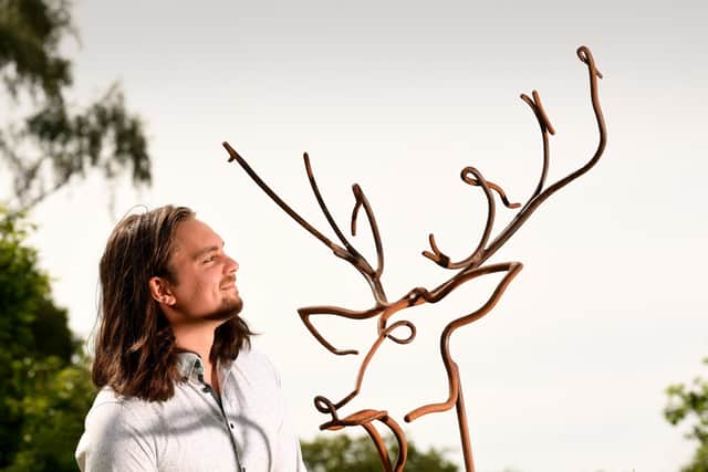 Contemporary Sculpture Trail at Newby Hall, Ripon. Ollie Holman pictured with his sculpture called Stags Head.