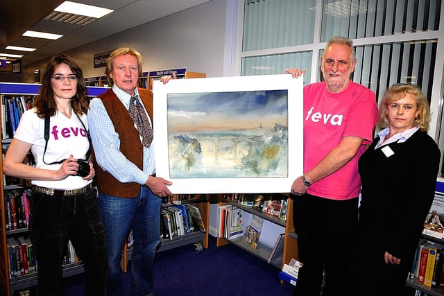 Yorkshire TV artist Granville Daniel Clarke 2nd left, pictured with his atmospheric watercolour entitled 'A Nidd Summer Light Stream' he created at the end of Feva 2010. Also present at Knaresborough Library are from left Feva photographer Tracey Maclean, Chairman Tony Cerexhe and Community & Information Officer Wendy Kent.