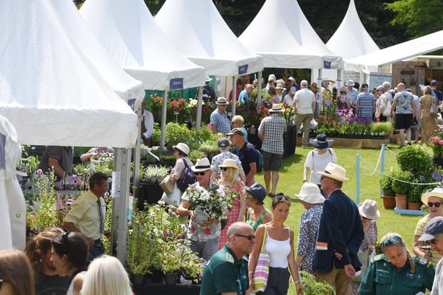 Visitors enjoying the flowers and plants on display at RHS Garden Harlow Carr