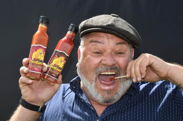 George Gibson of Crazy Canary Hot Sauce trying some of his Volcanic Fury sauce