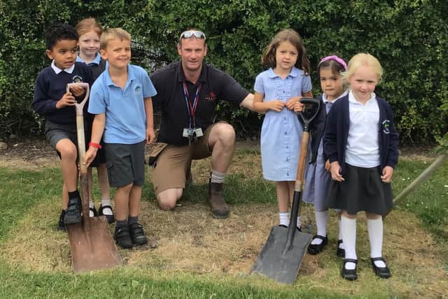 Children and teachers at Rossett Acre Primary School have celebrated the schools 50th birthday by planting a time capsule to be opened in 2047