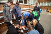 Hospitality students at Harrogate College preparing a vegetable planter.