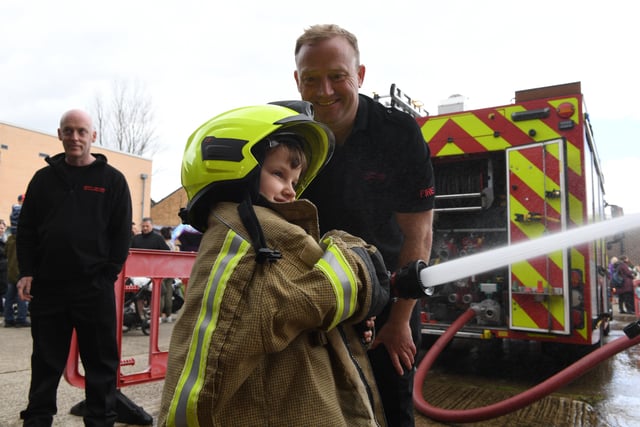 2nd July 2022
Harrogate fire station open day, Skipton Road, Harrogate.
Pictured dressed in full firefighter kit 6 year old Lily Champkins has a go with the fire hose
Picture Gerard Binks