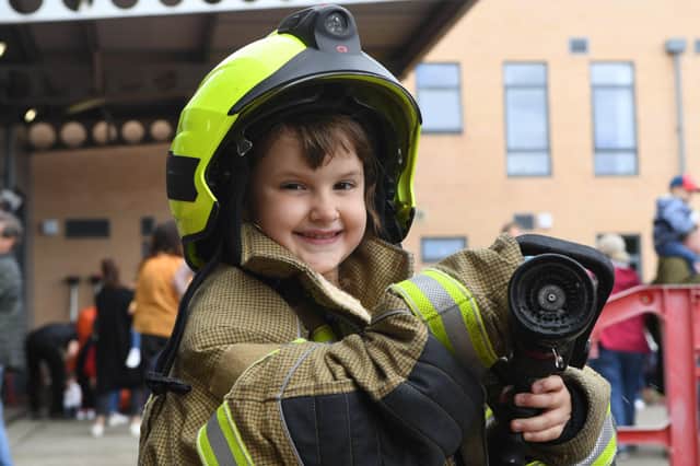 2nd July 2022
Harrogate fire station open day, Skipton Road, Harrogate.
Pictured dressed in full firefighter kit 6 year old Lily Champkins has a go with the fire hose
Picture Gerard Binks