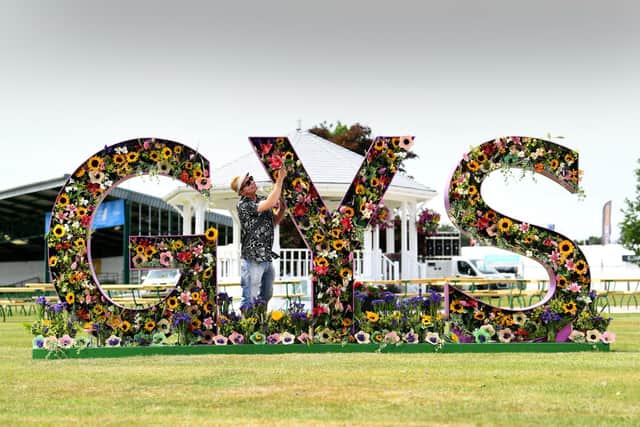 Jonathan Moseley putting the finishing touches to his Great Yorkshire Show Floral display
