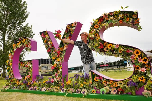 Jonathan Moseley putting the finishing touches to the Great Yorkshire Show floral display