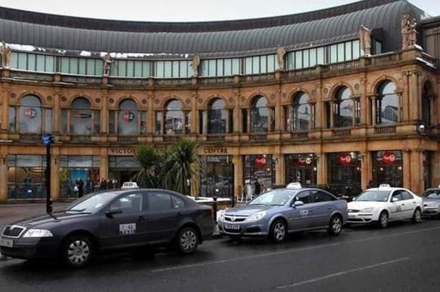 Taxis at the rank outside Harrogate's Victoria Shopping Centre.