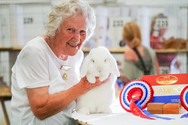 Paula Atkinson with her Dwarf Lop Red Eyed White Rabbit who was crowned Supreme Champion