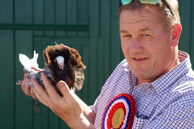 David Graham with his Jacobin Pigeon who was crowned Supreme Champion