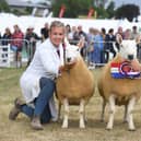 Mary Stones and Jack Brittain with their North Country Cheviot’s owned by Keith Stones of Nuncote Nook Farm who were crowned champions of the Non Accredited Sheep Pairs
