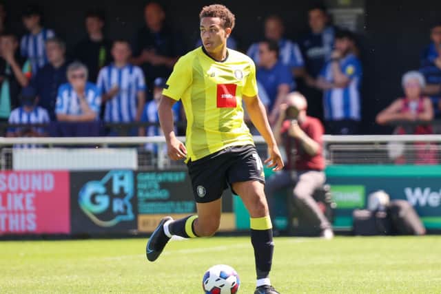 Harrogate Town defender Lewis Richards gets on the ball during Saturday's pre-season success over Huddersfield Town.