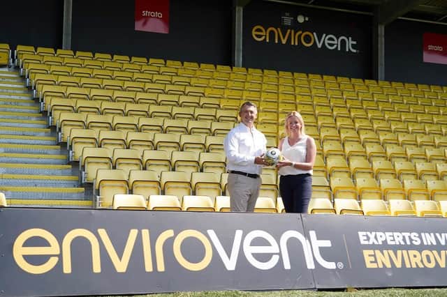 Andy Makin, managing director of EnviroVent, left, at Harrogate Town's Wetherby Road ground with the club's commercial director, Joanne Towler. Picture: Harrogate Town AFC