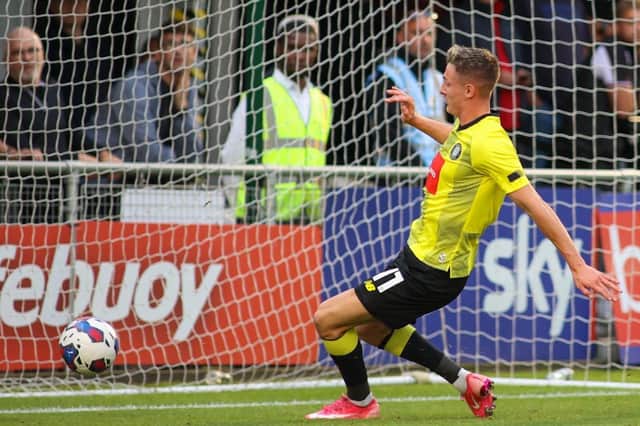 Max Wright taps the ball into an empty net during Harrogate Town's pre-season draw with Barnsley. Pictures: Matt Kirkham