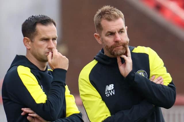 Harrogate Town's management team of Paul Thirlwell, left, and Simon Weaver still have decisions to make on a number of vacant positions in the Sulphurites' squad.