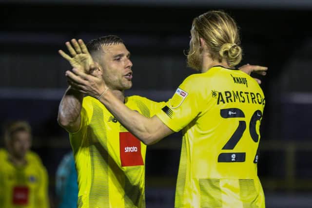 Harrogate Town strike duo Jack Muldoon, left, and Luke Armstong celebrate a goal during the 2021/22 campaign.