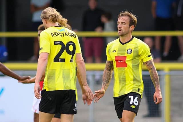Luke Armstrong, left, and Alex Pattison celebrate the latter's goal during Harrogate Town's 2-2 pre-season friendly draw with League One Barnsley.