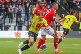 Alex Pattison celebrates after firing Harrogate Town into a 43rd-minute lead against Swindon Town at the EnviroVent Stadium. Pictures: Matt Kirkham