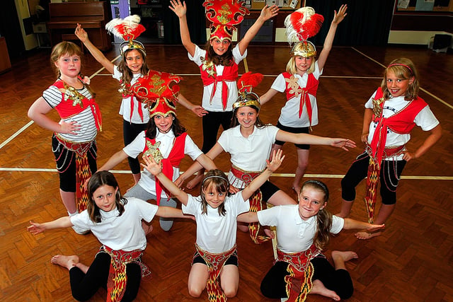Dance pupils from South Milford Primary School don their feathered head pieces and beaded skirts ready to strut their moves in the Leeds Carnival.