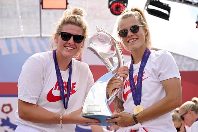 LONDON, ENGLAND - AUGUST 01: Millie Bright and Rachel Daly of England pose for a photo with the UEFA Womenâ€TMs EURO 2022 Trophy during the England Women's Team Celebration at Trafalgar Square on August 01, 2022 in London, England. The England Women's Football team beat Germany 2-1 in the Final of The UEFA European Women's Championship last night at Wembley Stadium.  (Photo by Leon Neal/Getty Images)