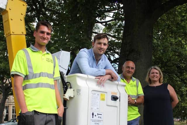 Harrogate Coun Sam Gibbs and head of parks and environmental services Alison Wilson with Yorkshire Lighting and Electrical Services.