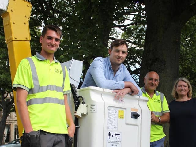 Harrogate Coun Sam Gibbs and head of parks and environmental services Alison Wilson with Yorkshire Lighting and Electrical Services.