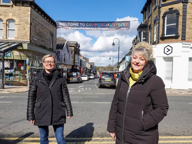 Flying the flag for Commercial Street shops with a giant new banner - Harrogate BID chair Sara Ferguson and Sue Kramer with Commercial Street Retailers group.