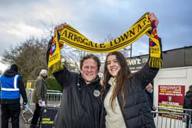 Showing their support with a Harrogate Town scarf - Fans Dave Worton and daughter Molly before a match earlier in the season.