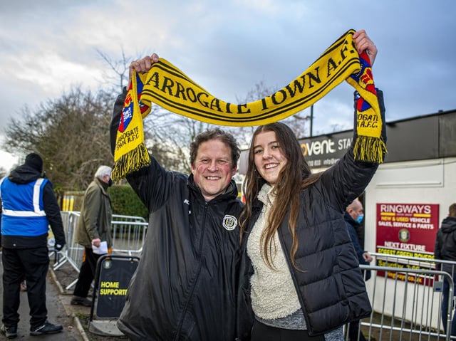 Showing their support with a Harrogate Town scarf - Fans Dave Worton and daughter Molly before a match earlier in the season.